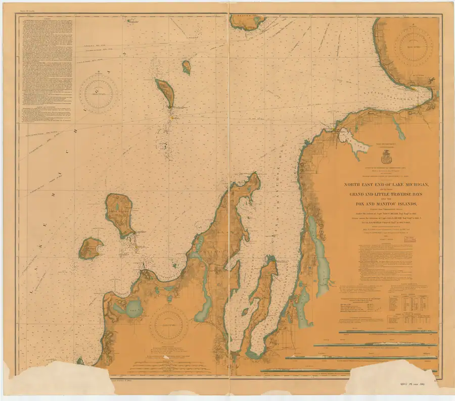 A large vintage nautical chart showing coastlines, soundings, navigational markings, and compass roses.