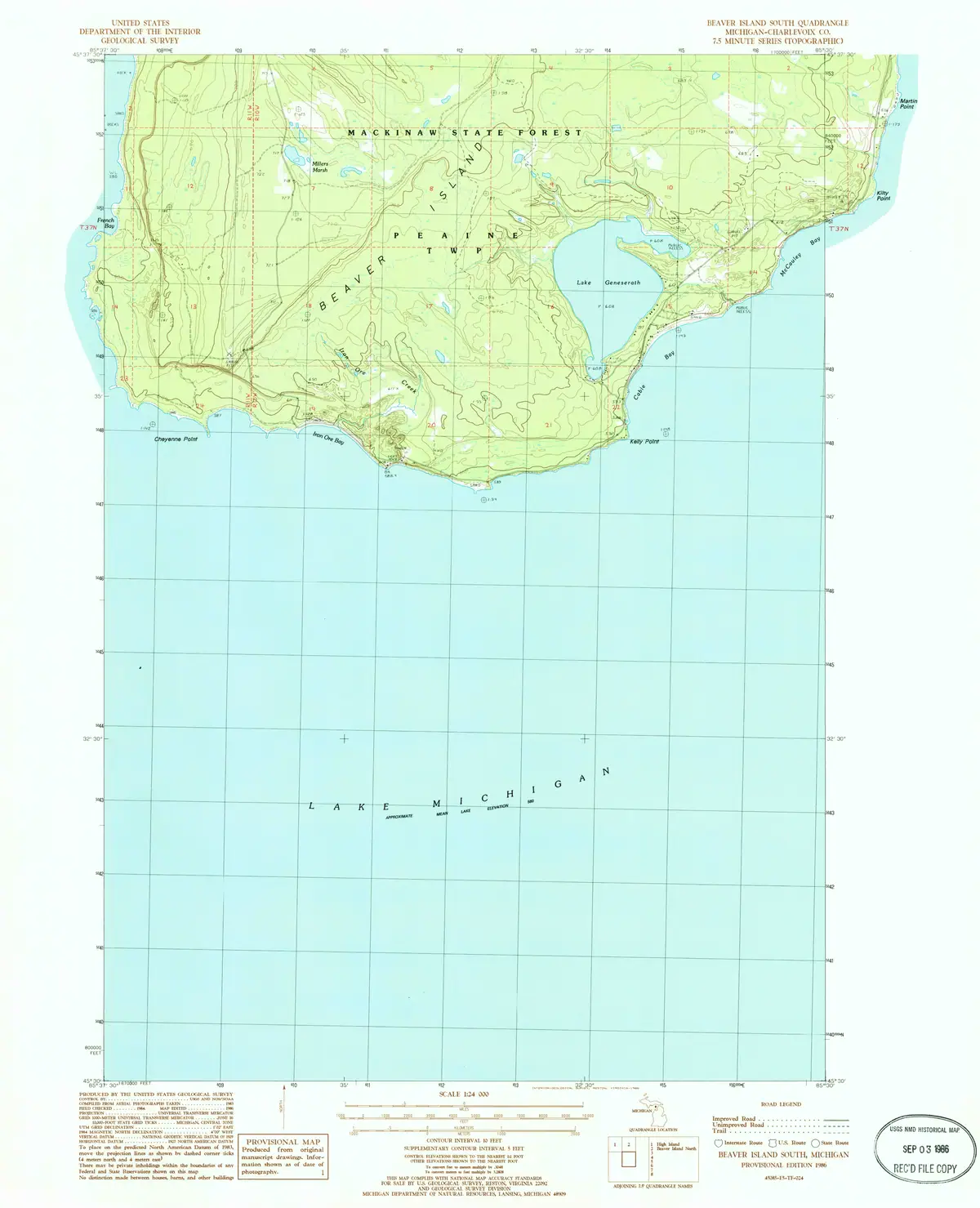 Topographic map showing a forested landmass, inland water, surrounding shoreline, and gridded open water.