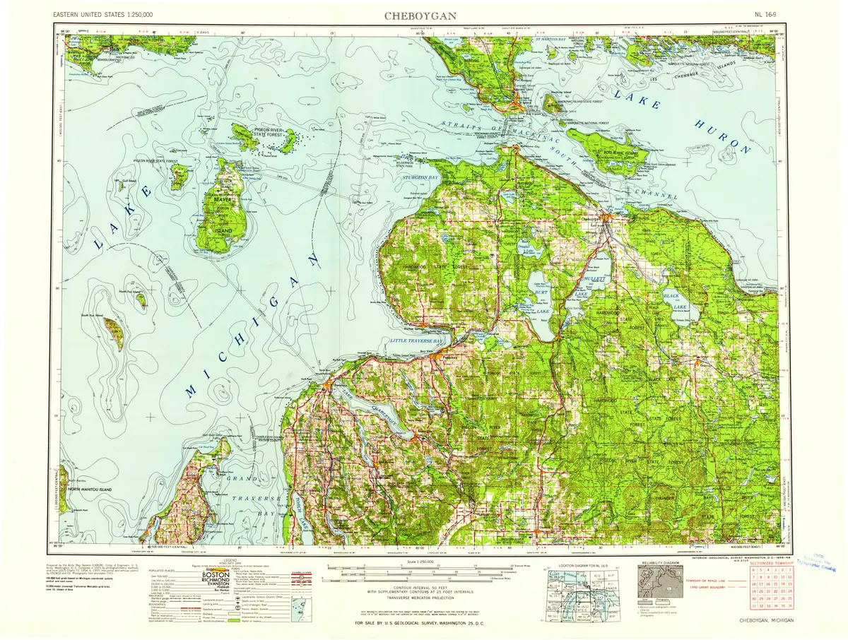 Colored topographic map showing wooded terrain, waterways, roads, and surrounding offshore features.