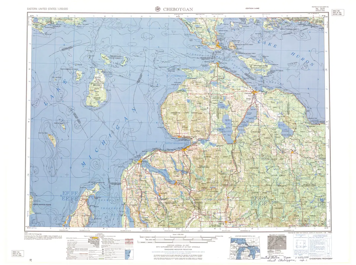 A colored topographic map showing waterways, shorelines, roads, terrain contours, and forested areas.