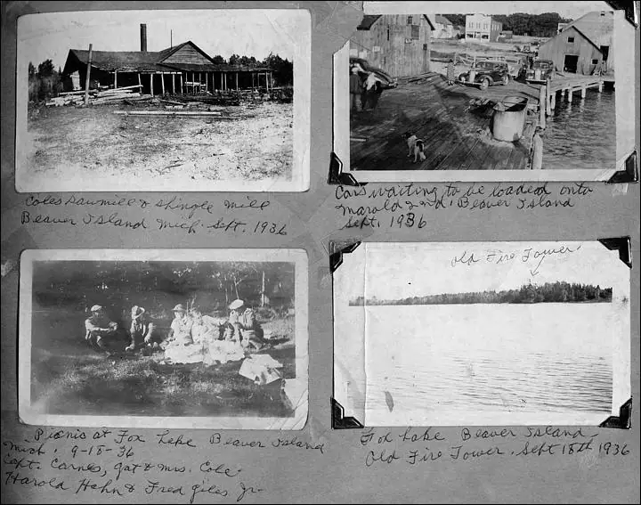 Scrapbook page with four black-and-white photographs and handwritten captions showing buildings, a dock, a picnic, and a watery landscape.