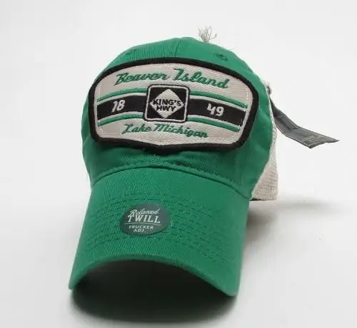 Green baseball cap with an embroidered front patch and adjustable back strap.