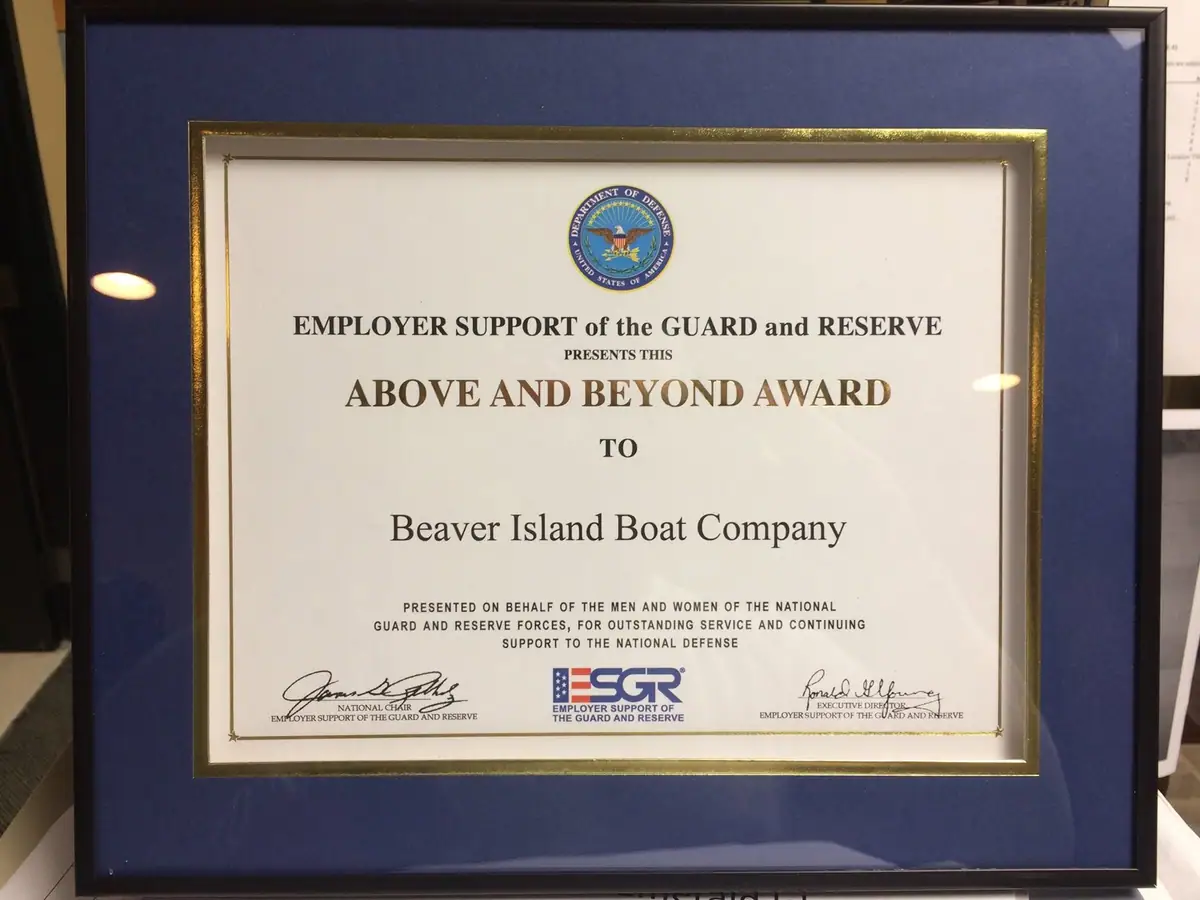 Framed Above and Beyond Award certificate honoring a boat company for support of Guard and Reserve personnel.