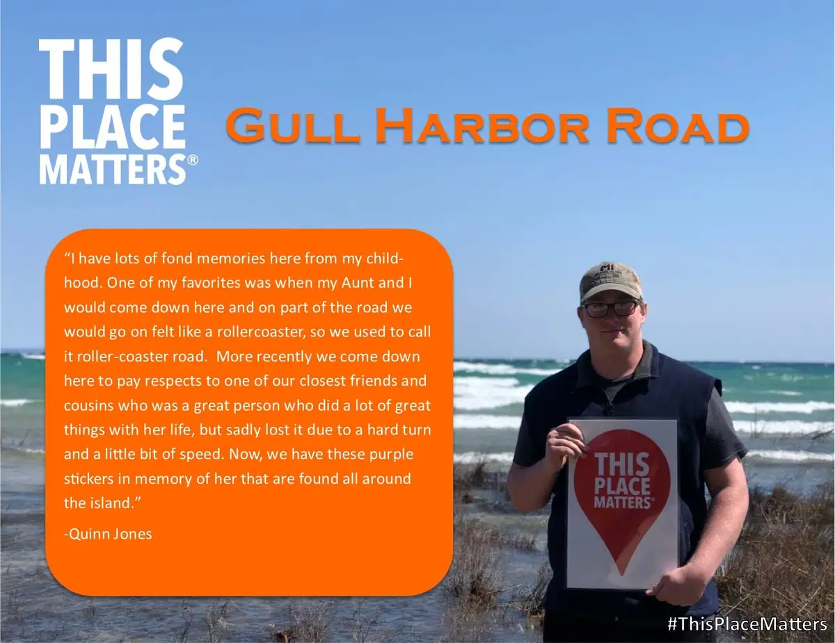A man holds a “THIS PLACE MATTERS” sign beside a wave-washed shoreline, with a testimonial text panel overlaid.
