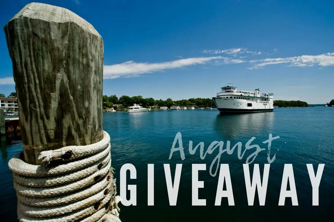 A passenger ferry crosses a blue harbor beside a rope-wrapped wooden mooring post, beneath giveaway lettering.