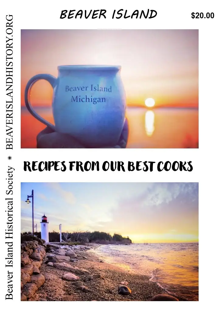 Cookbook cover featuring a mug at sunset above a lighthouse shoreline photograph.