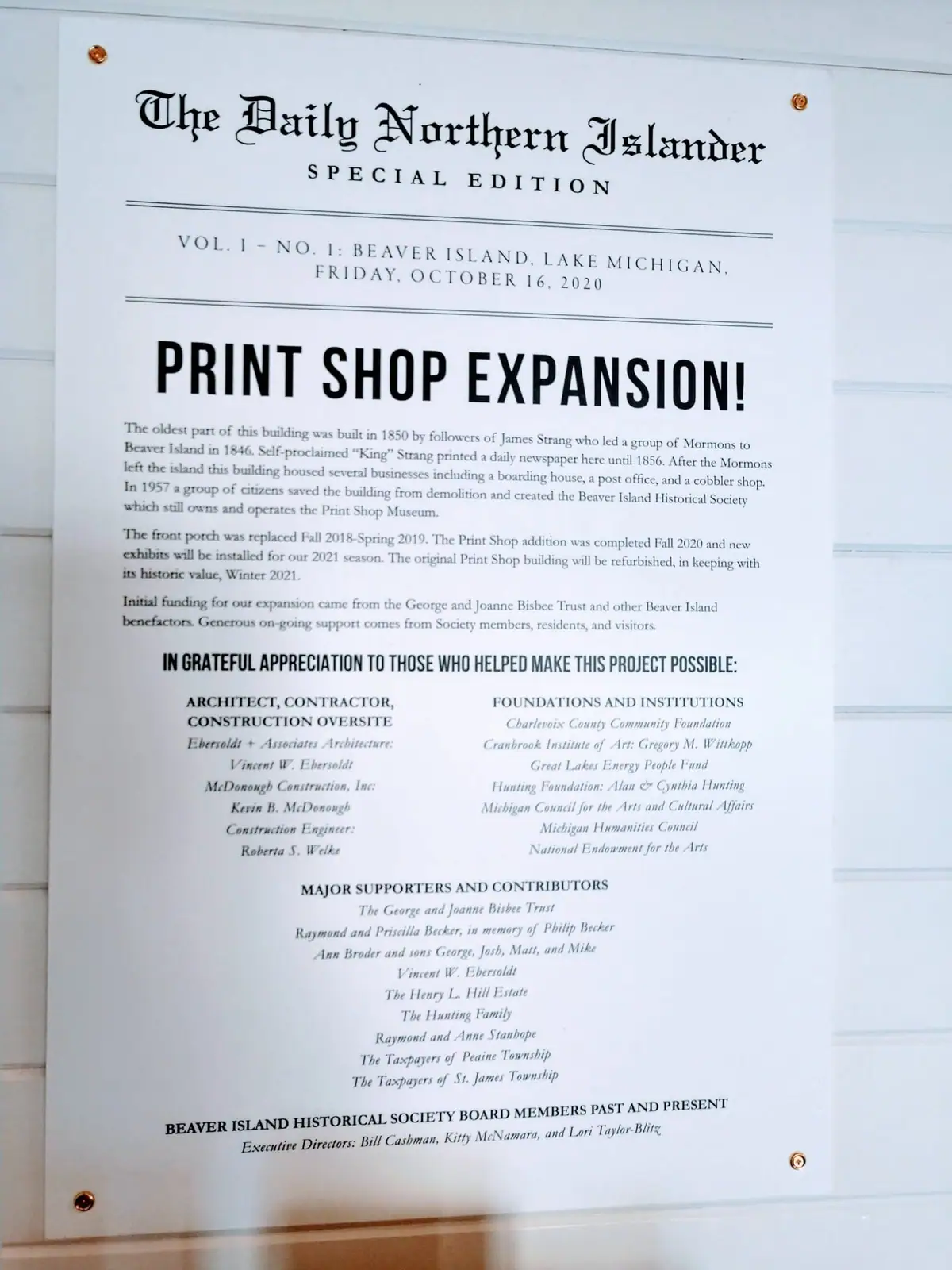 Photographed printed notice titled “Print Shop Expansion!” with historical background and supporter lists.