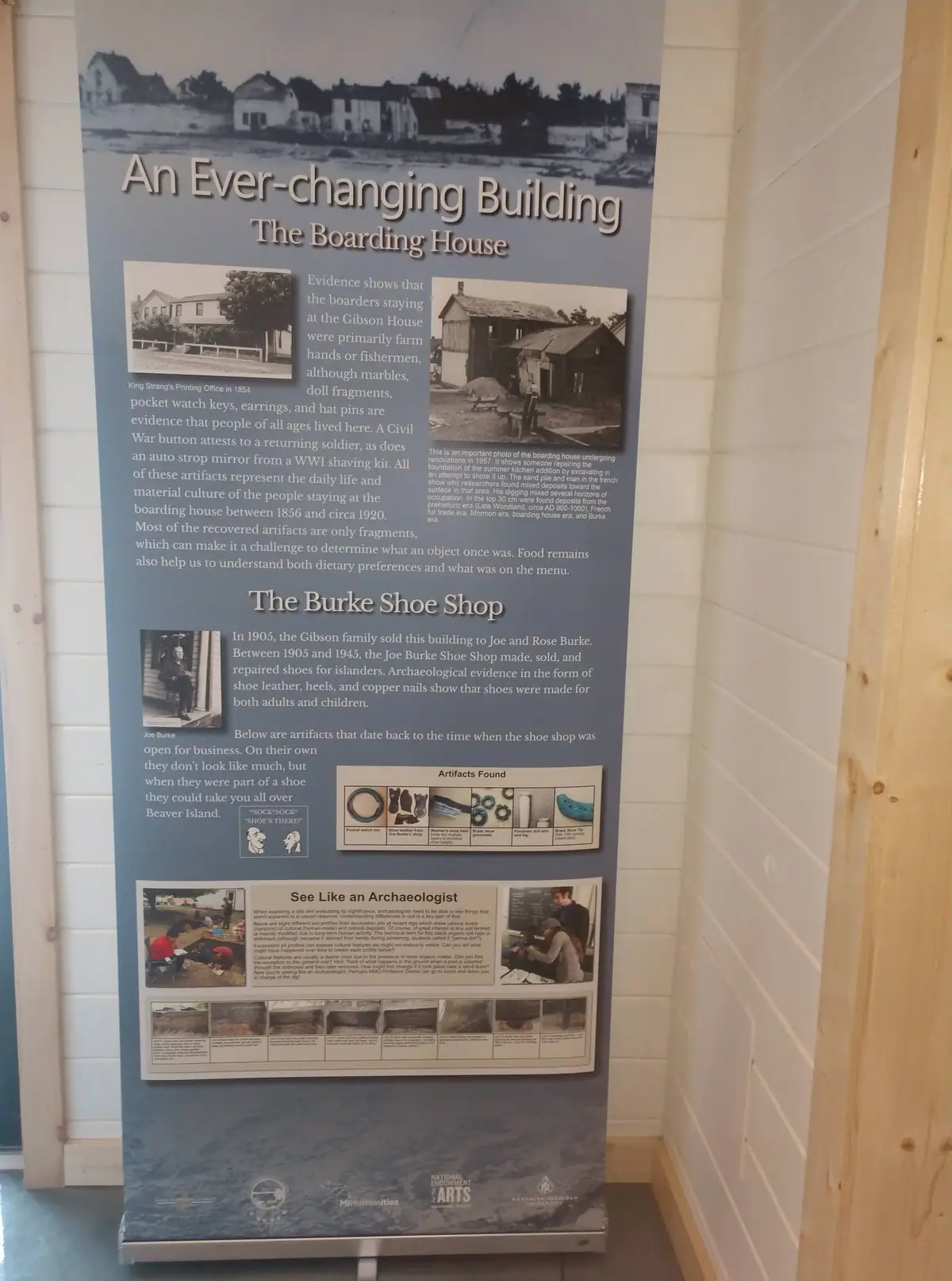 Photograph of a freestanding historical exhibit panel titled “An Ever-changing Building.”