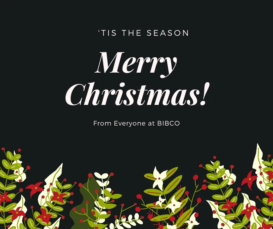 Holiday greeting graphic with white lettering and a colorful floral border on a dark background.