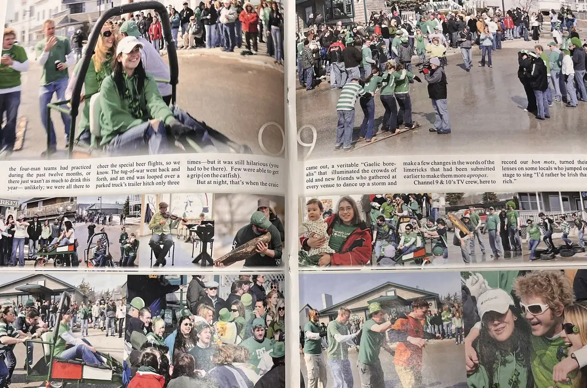 Photographed magazine spread showing crowds, green-clad participants, a wagon, and tug-of-war scenes.