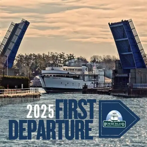 White passenger ferry passing between two raised blue drawbridges at dusk, with bold departure text across the foreground.