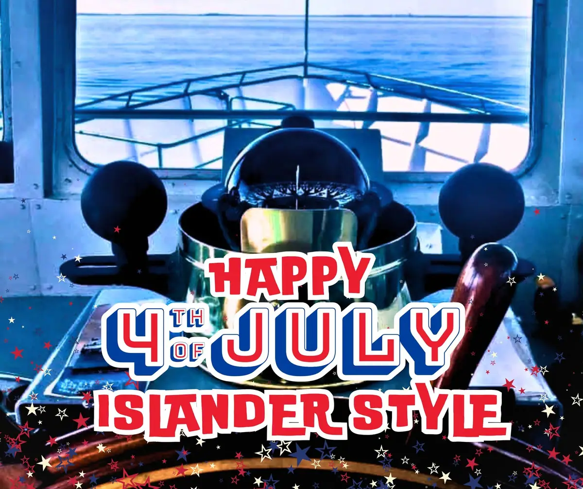 A vessel’s wheelhouse with navigation controls, festive stars, and large patriotic lettering.