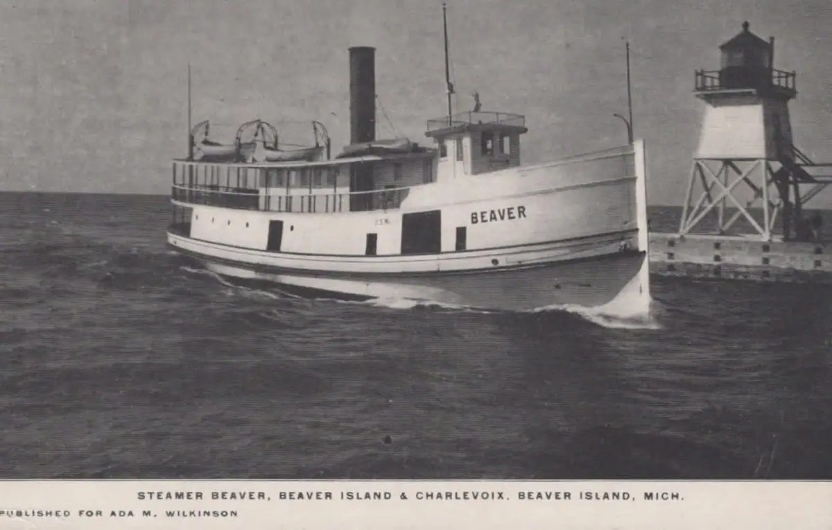 Steamer BEAVER passing a pier-mounted lighthouse.