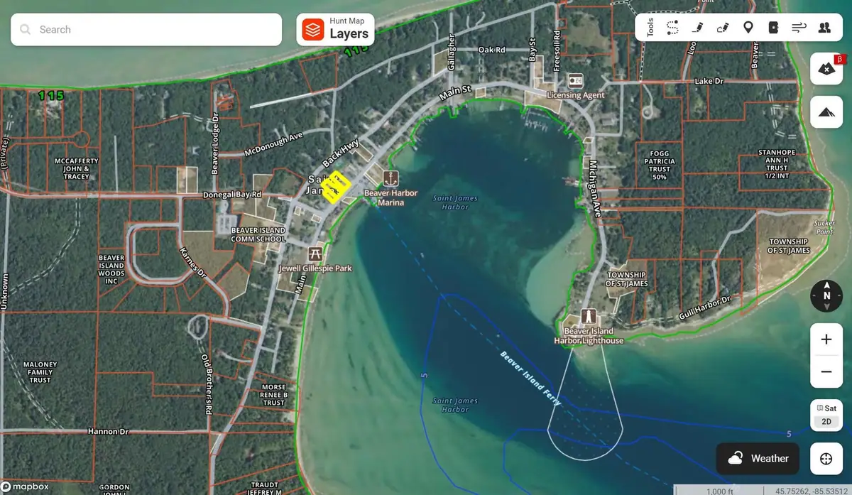 Aerial property map showing a harbor, roads, parcel boundaries, a marina, and a lighthouse.