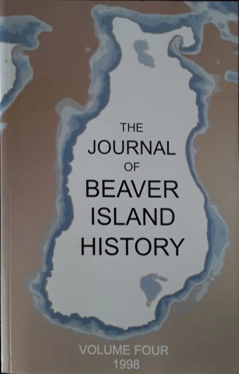Photograph of a journal cover with an irregular blue-bordered shape and large printed title.
